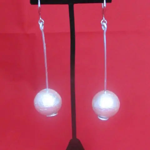 https://thebrownstonewoman.com/products/the-modern-pearl-drop